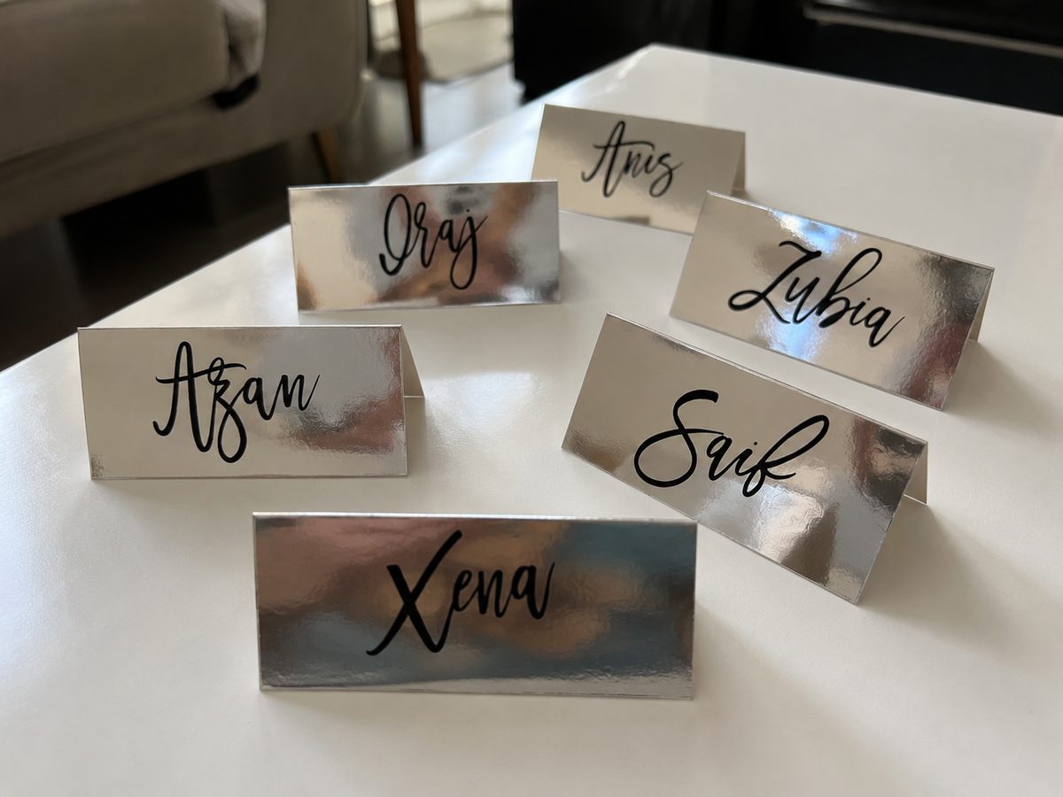 Mirror finish personalised place cards with names in calligraphy